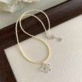Korean style women's copper necklace with beaded hollow flower pendant and electroplated finish