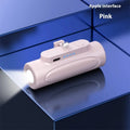 Black Creative Power Bank Glare Flashlight showing LED light on and compact 83mm size next to a mobile phone.