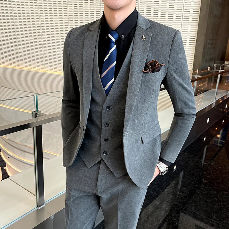 Men's slim fit British style business suit in black cotton blend fabric with adhesive interlining construction