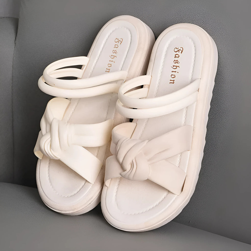 Women's black and white soft back outdoor sandals with flower detail and PVC sole