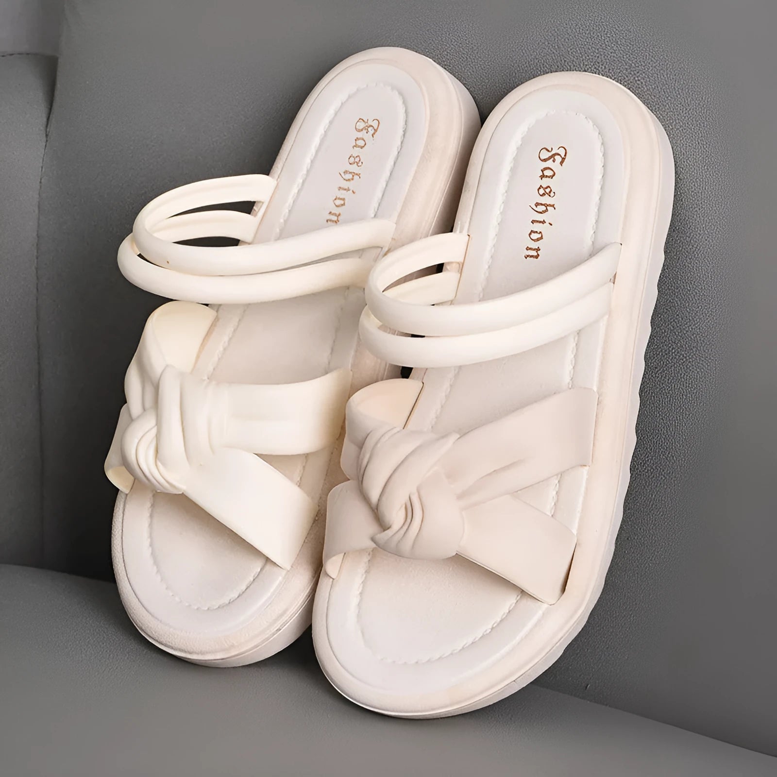 Women's black and white soft back outdoor sandals with flower detail and PVC sole