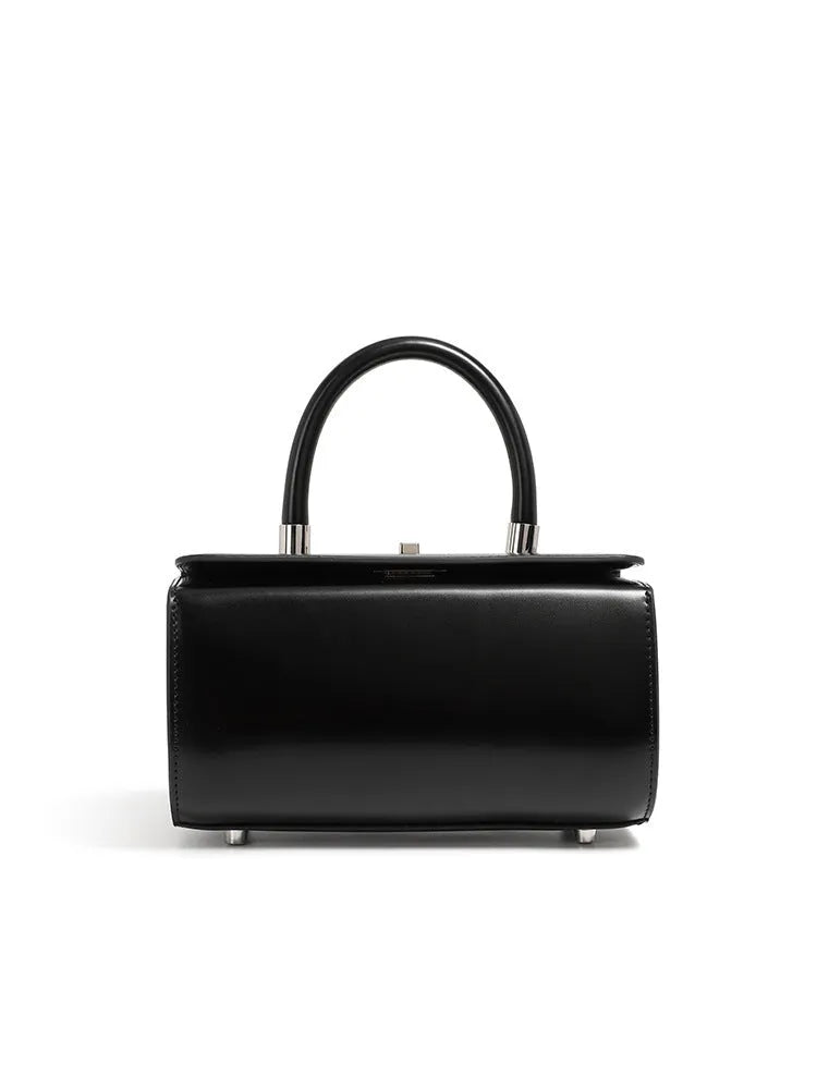 Women's cowhide leather crossbody bag in clamshell design with single shoulder strap