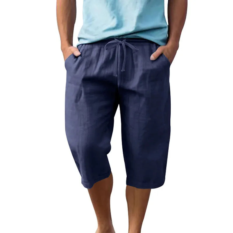Men's solid colour linen shorts with a drawstring waistband in a light blue shade
