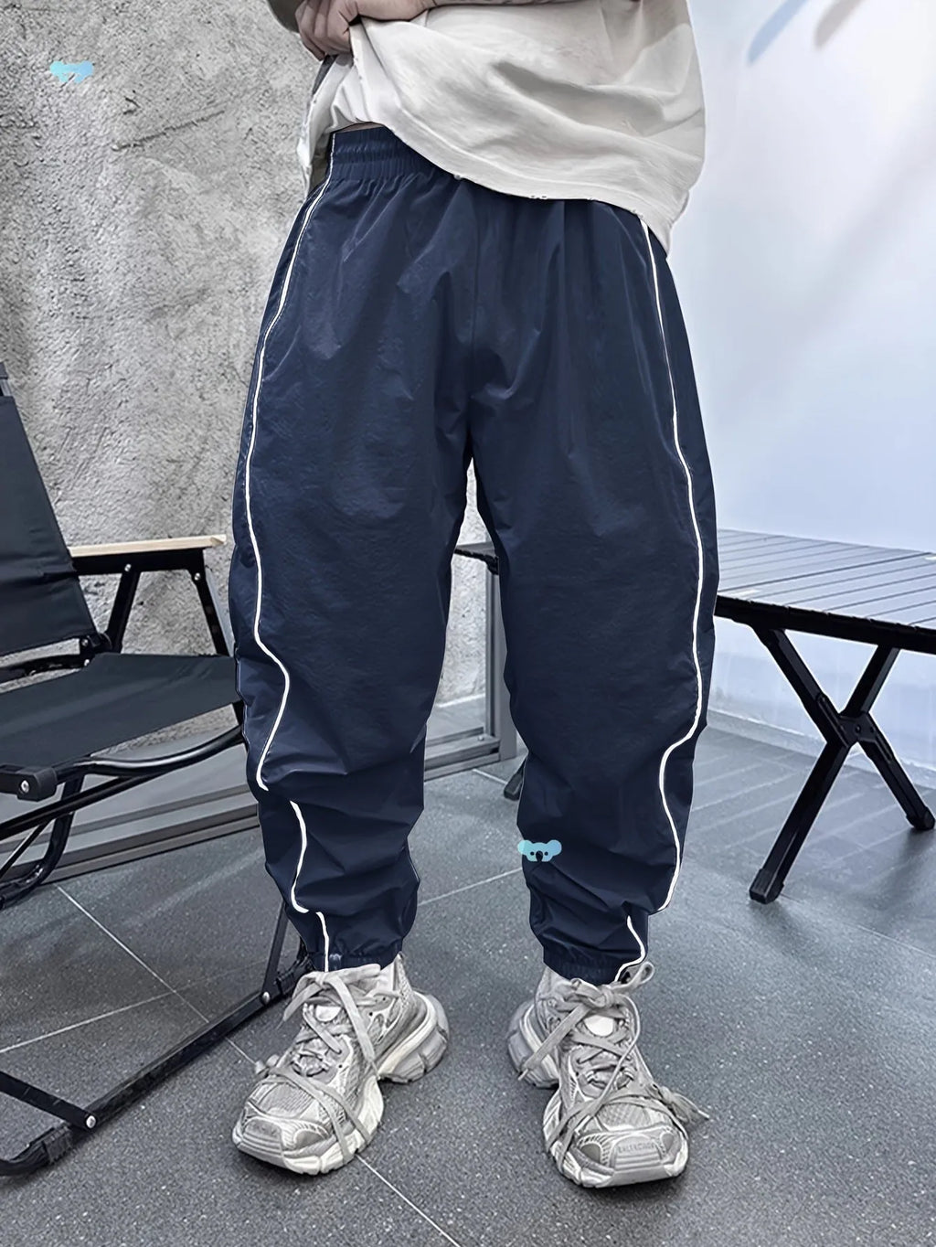 Men's loose fit bamboo fibre sports trousers in khaki with cropped length and elasticated waist.