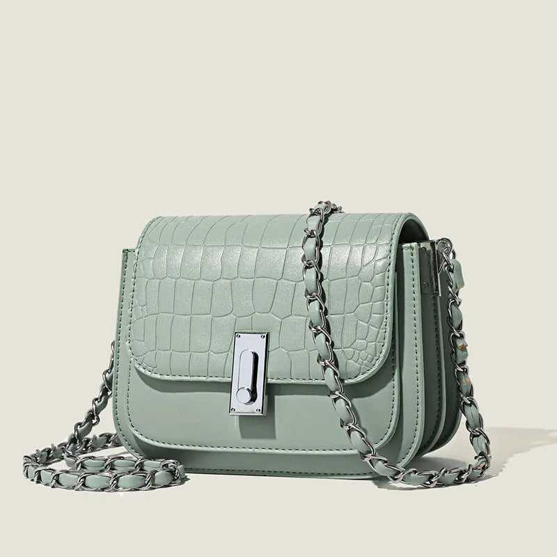 Green soft square women's cross-body shoulder bag with chain strap and external pockets.