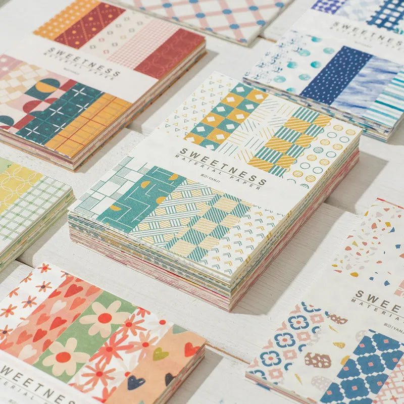 Pack of 50 retro-style decorative note papers with dessert-themed designs in ten colours.