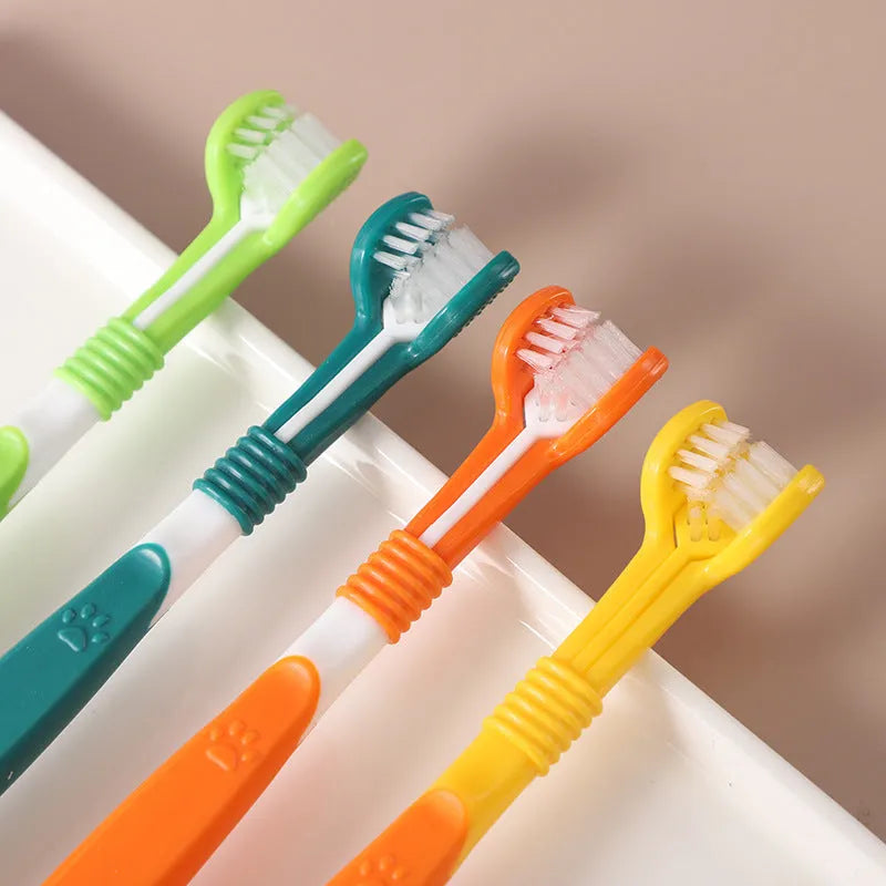 A pet toothbrush with a plastic nylon head and handle, shown in one of its available colours.