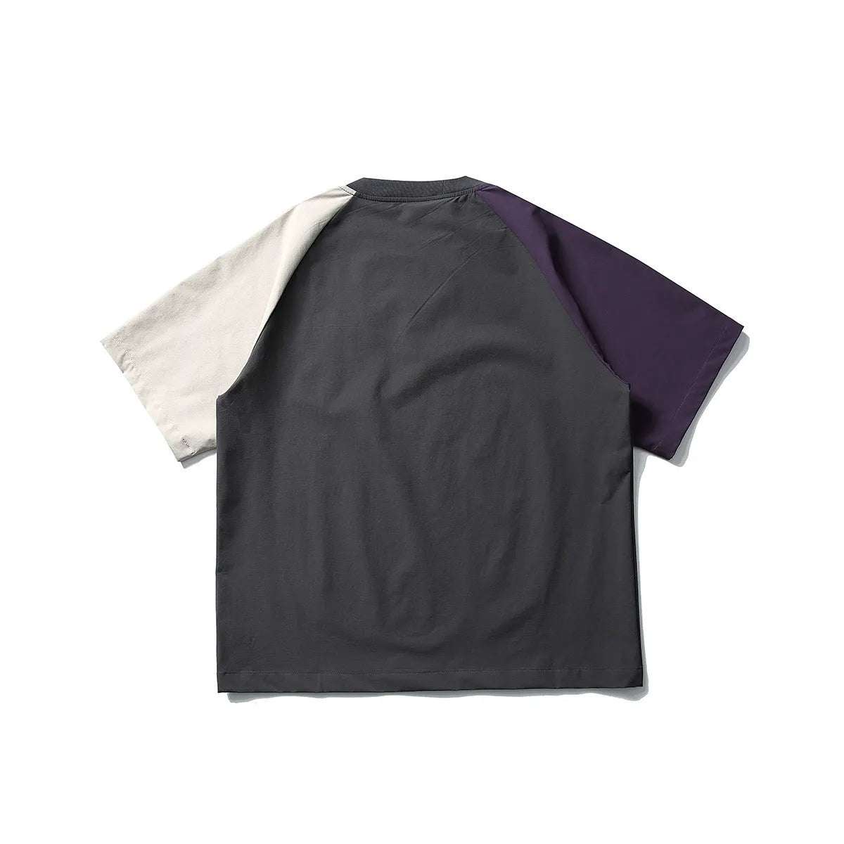Dark grey men's loose-fit T-shirt with contrast raglan sleeves on a hanger.