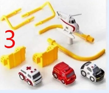 Big Adventure plastic toy set with multi-level parking garage, car tracks, and toy vehicles laid out for play.