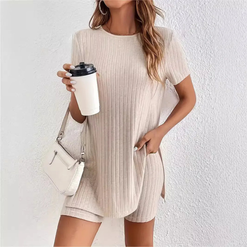 Women's coloured cotton lounge suit with crew neck top, shorts, and ribbed detail in grey.