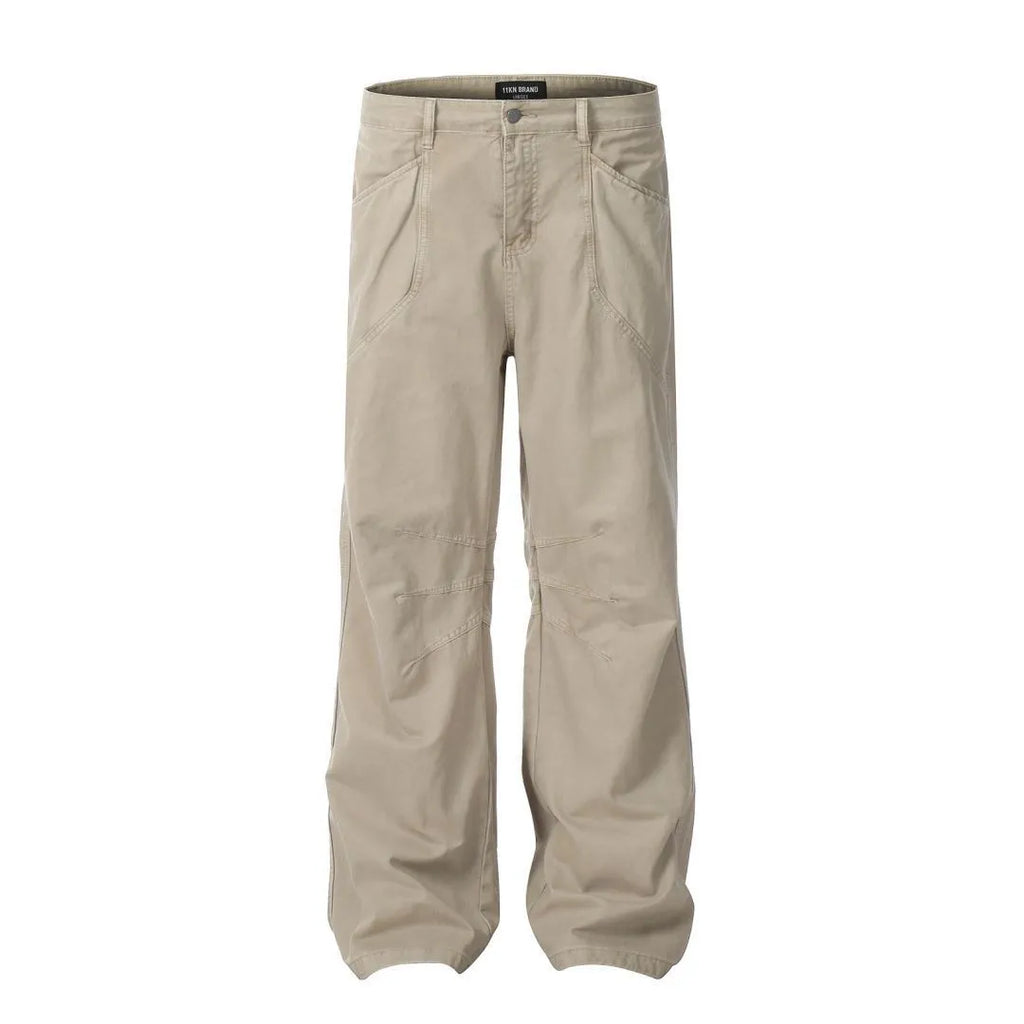 Men's brown loose-fit straight leg trousers with a high waist and wide-leg style on a hanger.