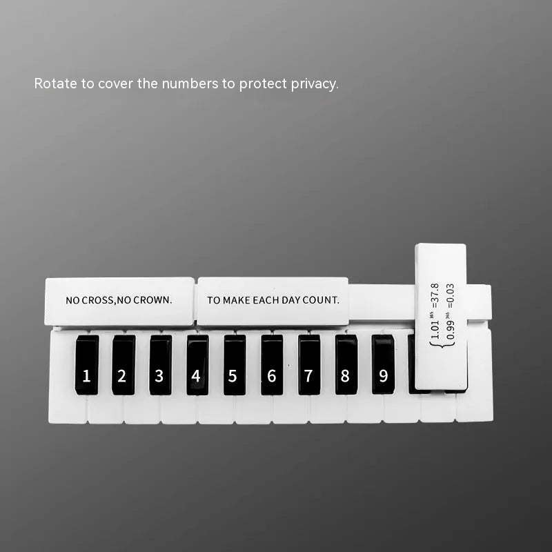 Black and white plastic piano-shaped parking sign with 'Piano Parking' text