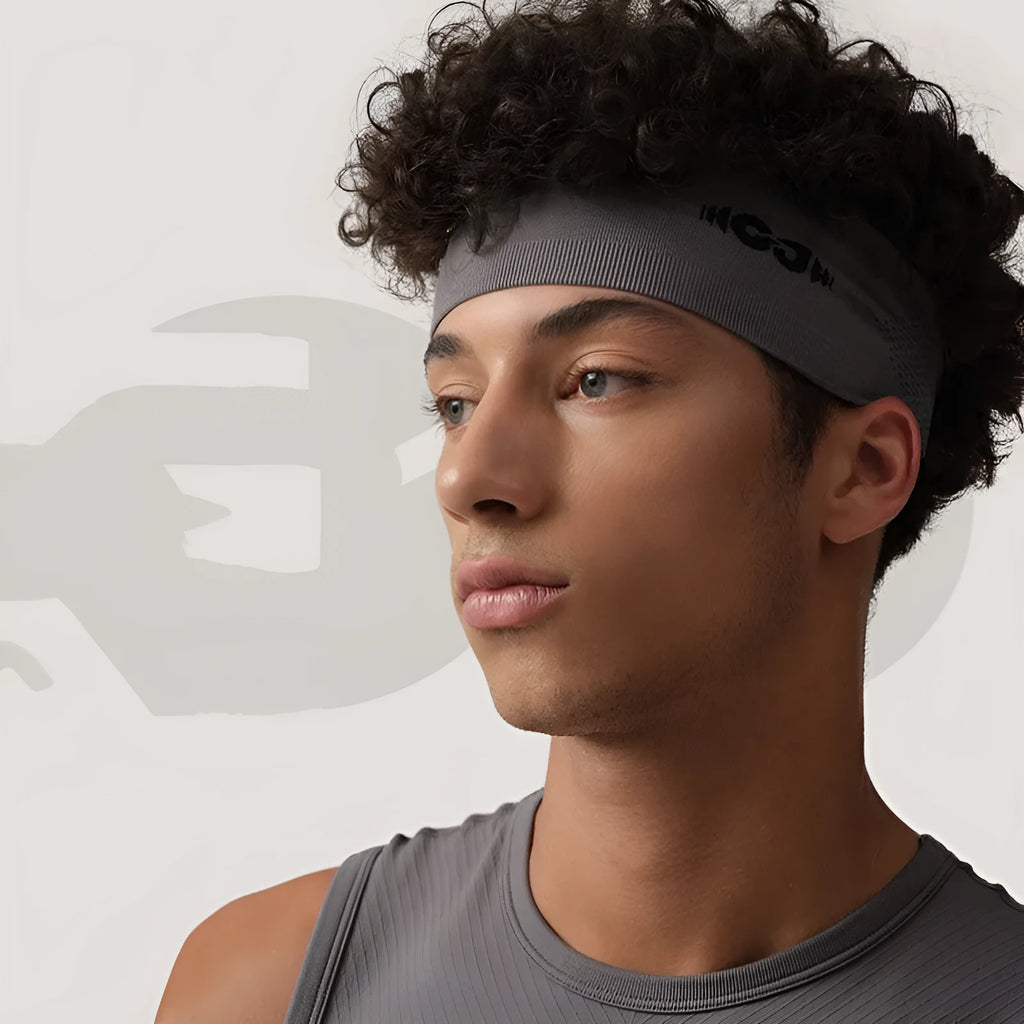 Seamless knitted exercise hair band in black, grey, and blue colours for sports