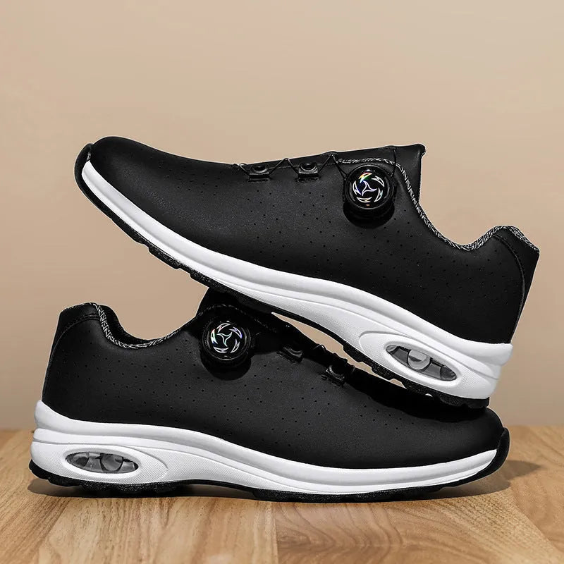 Man's black and white low-top casual tennis shoes with mesh upper and cross shoulder straps.