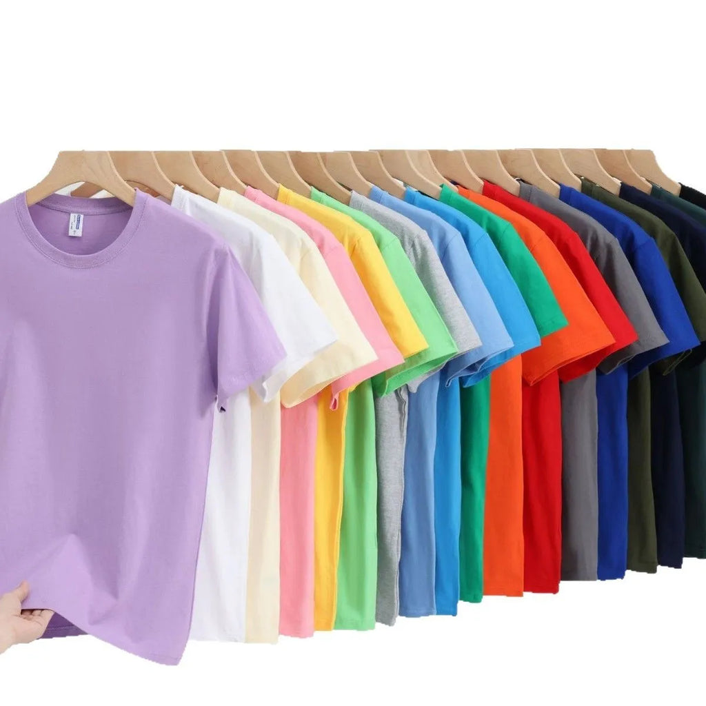 Unisex loose fit cotton t-shirt shown in multiple solid colours including navy blue, red, and white