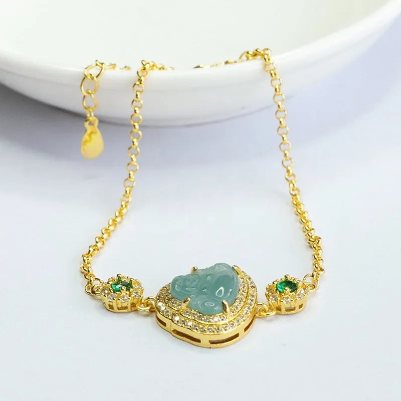 Jade bracelet with carved blue Maitreya Buddha charm and adjustable gold clasp