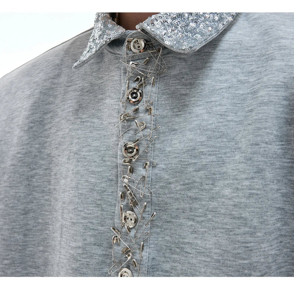 Loose fit black square neck short sleeve shirt with sequin and metal decoration details.