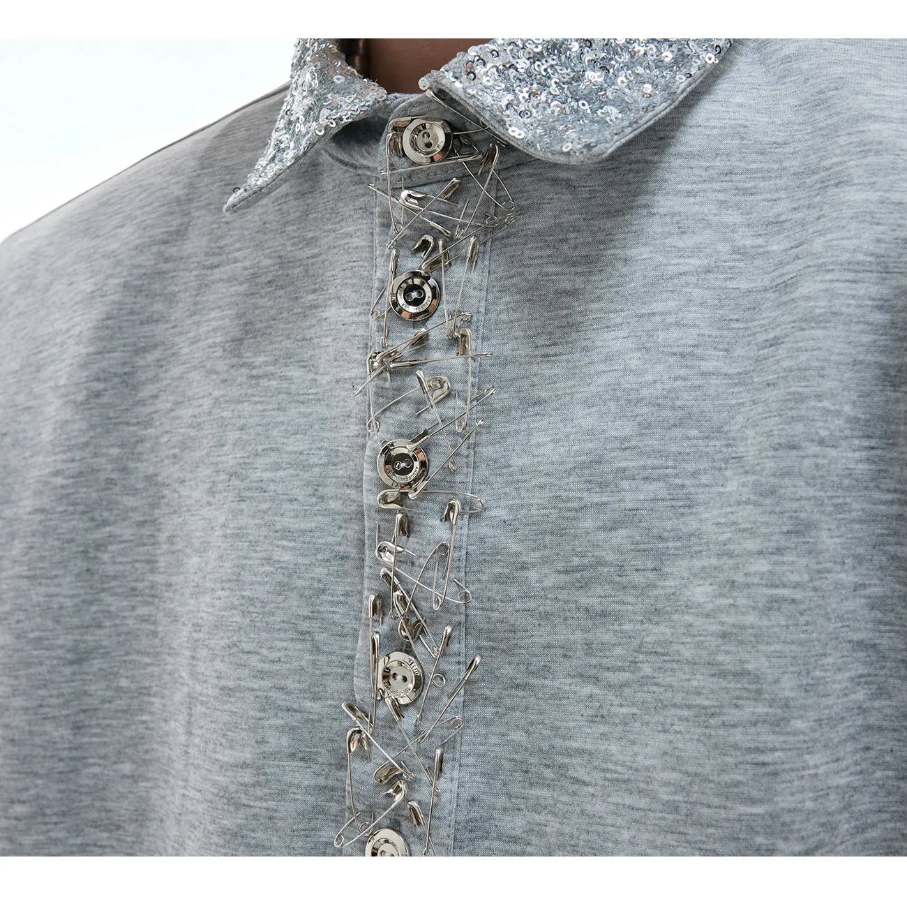 Loose fit black square neck short sleeve shirt with sequin and metal decoration details.