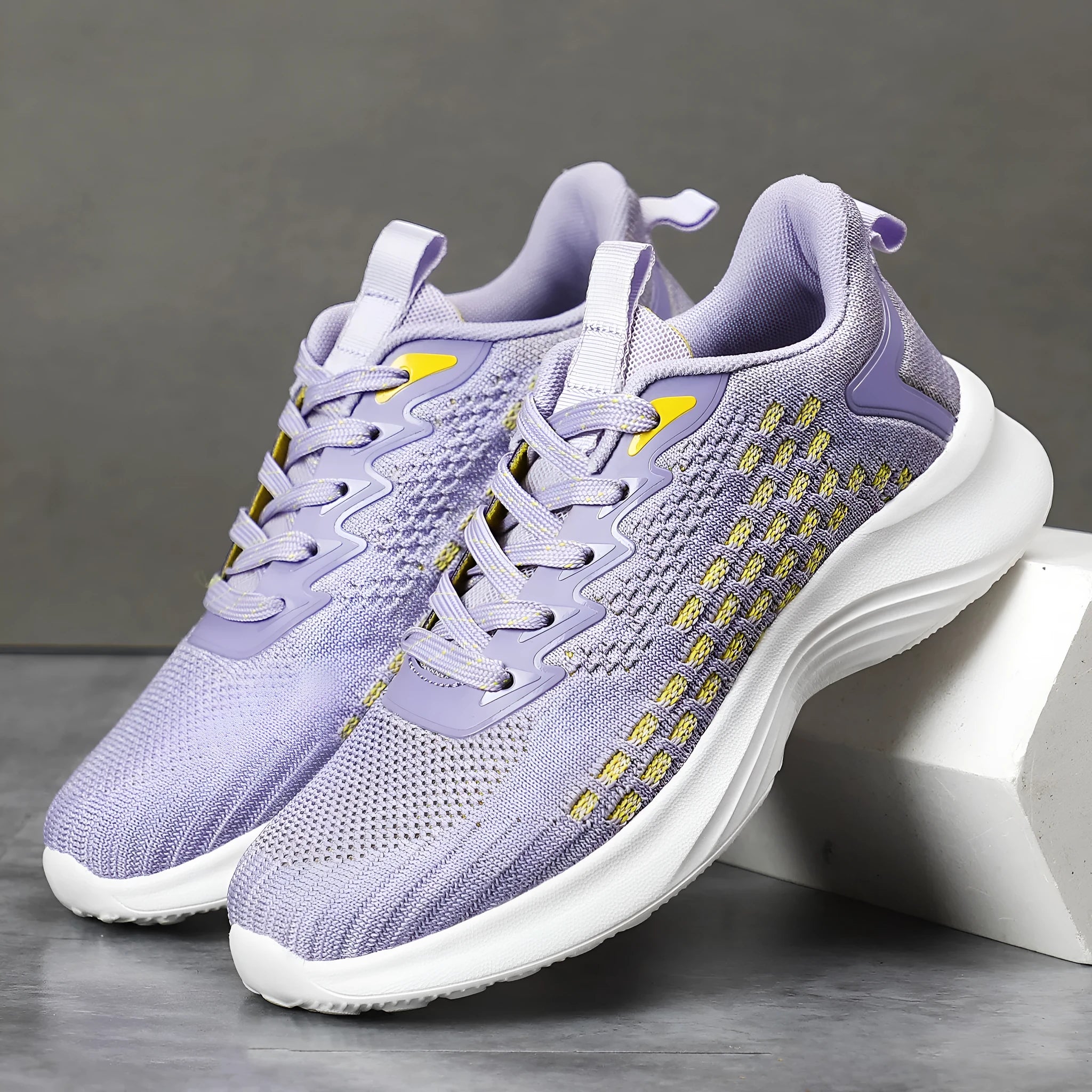 Women's lavender purple and sapphire blue Flyknit running shoes with striped pattern and mesh lining