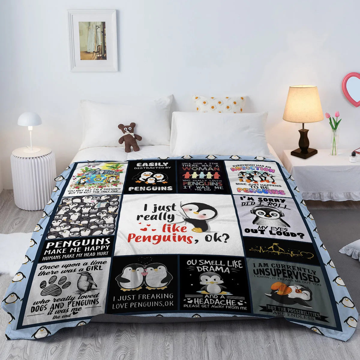 Multicoloured penguin flannel velvet throw blanket on sofa with hemmed edges