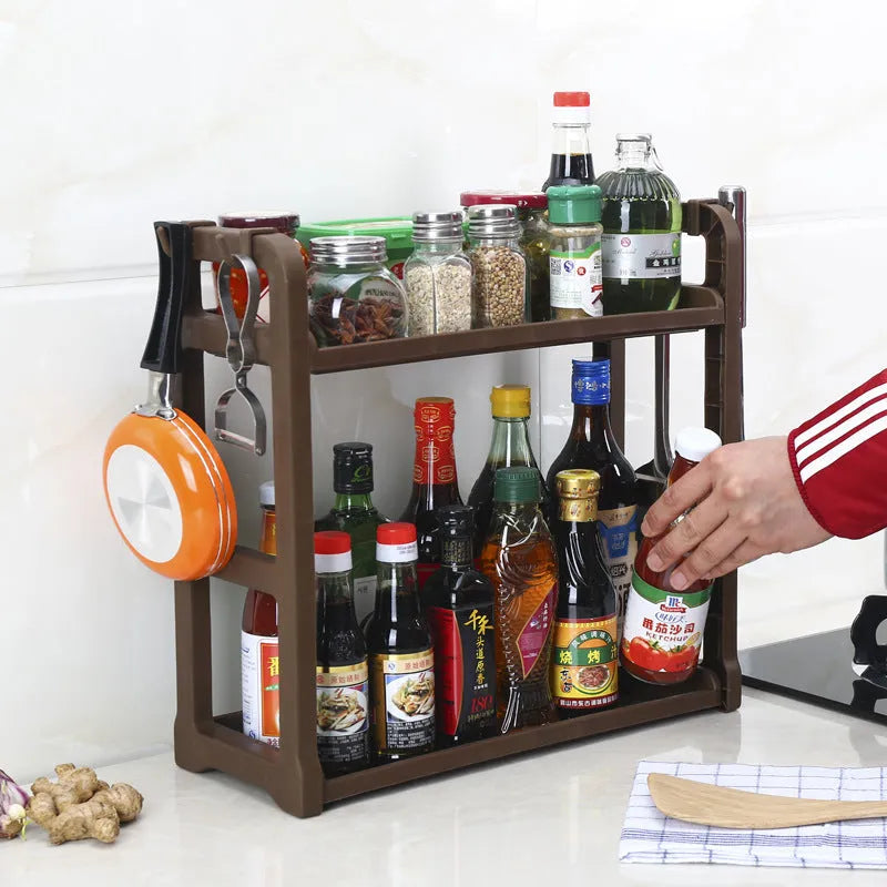 Foldable multi-layer kitchen storage rack in a choice of colours on a countertop.