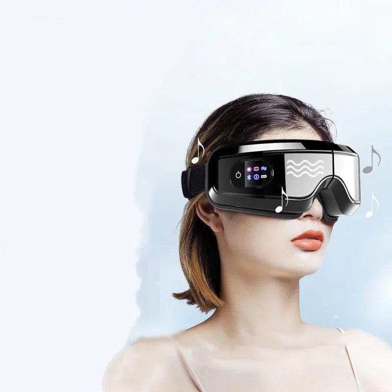 White eye massager with 16D airbag system, hot compress, and Bluetooth music for migraine relief