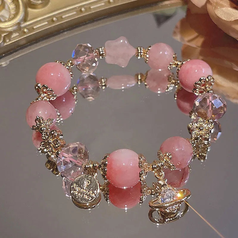 Women's bracelet with snowflake pendant and bow charm in galaxy colour