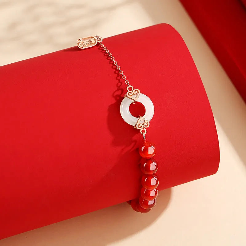 Women's sterling silver 925 bracelet with peace buckle, xiangyun, and fu character charms.