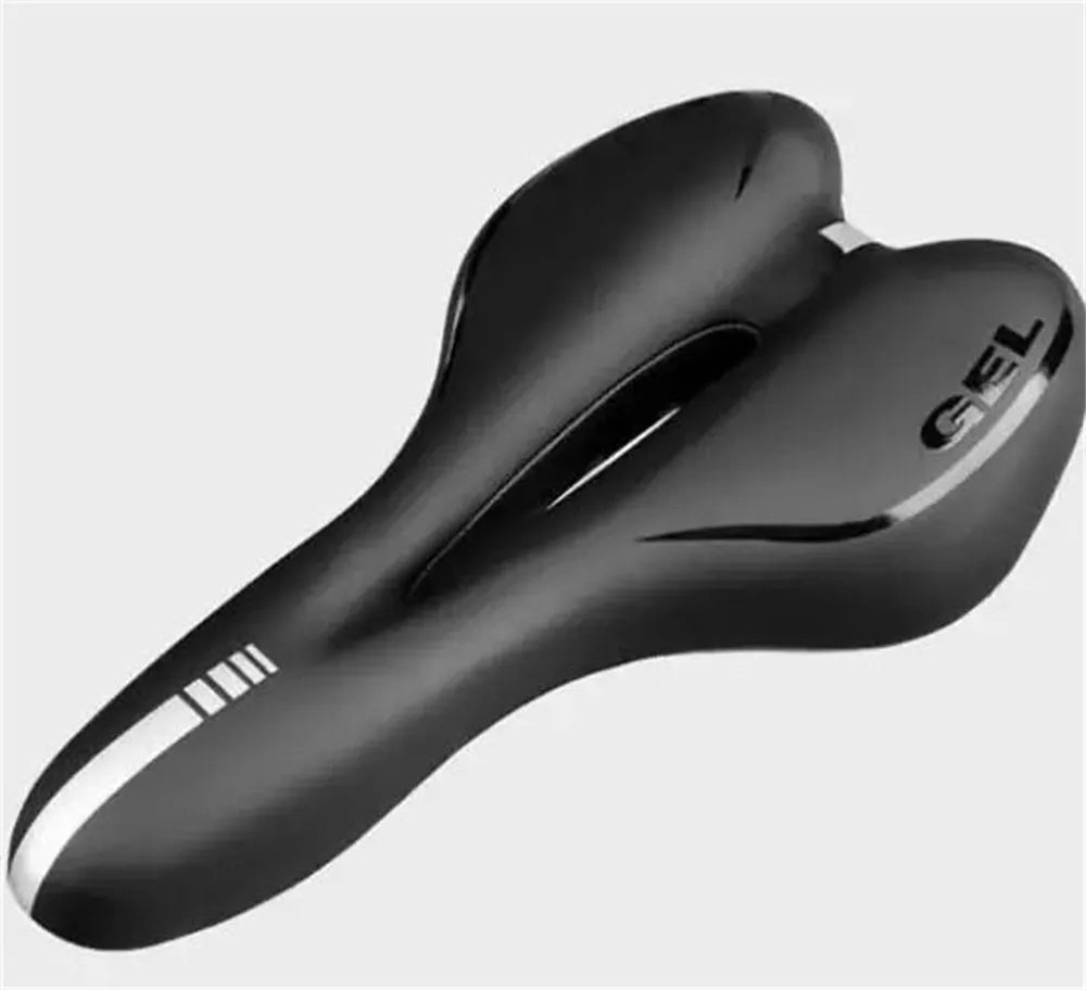 Soft silicone bicycle saddle cushion with black PU leather cover, shown with included waterproof cover, wrench, and puncture repair kit.