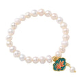 White freshwater pearl bracelet with goldfish pendant and lotus design in vintage baroque style