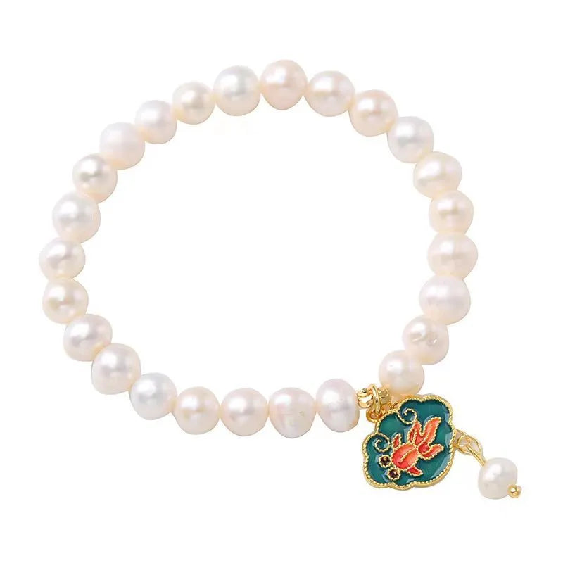 White freshwater pearl bracelet with goldfish pendant and lotus design in vintage baroque style