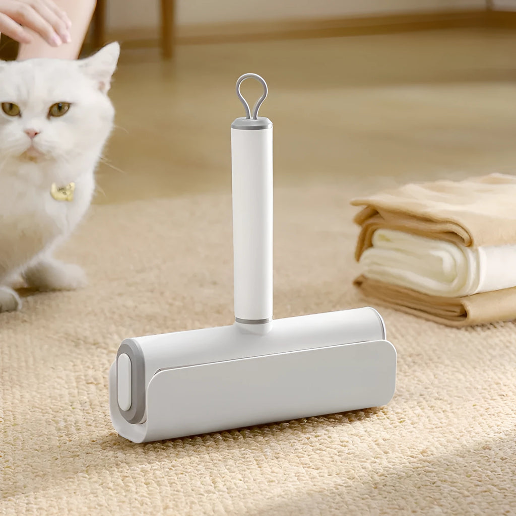 Refillable lint remover roller with tearable paper for pet hair removal on household surfaces