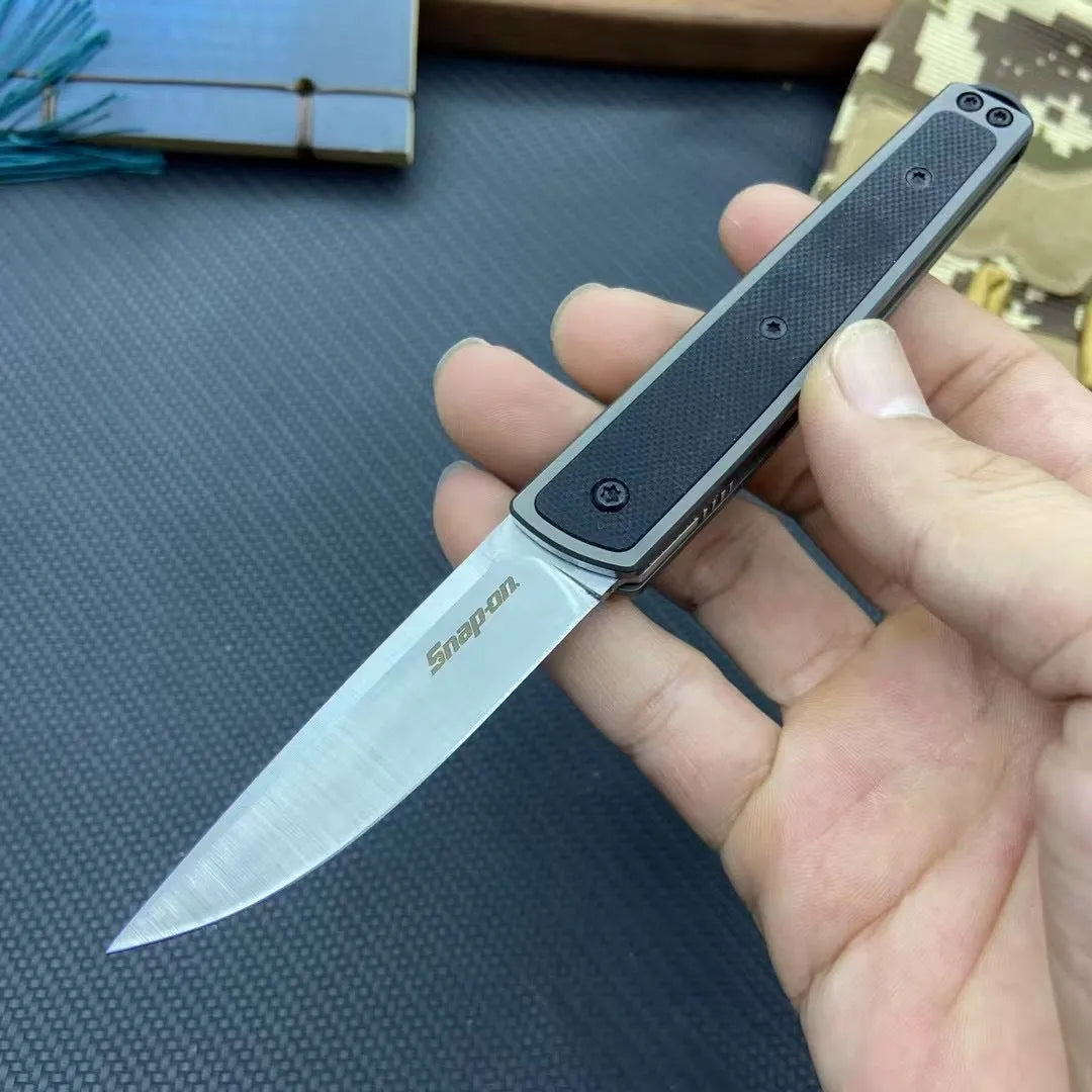 CRKT 7190 folding fruit knife with stainless steel blade in black, red, or coffee colour, showing closed and open positions