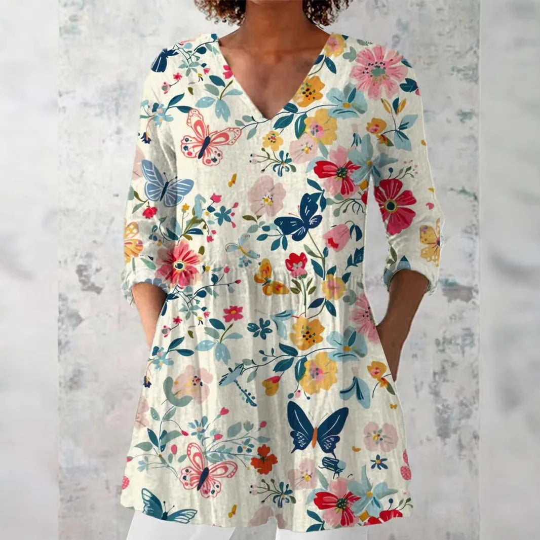 Women's retro print long-sleeved polyester top on a hanger, showing slim fit and detailed digital pattern.