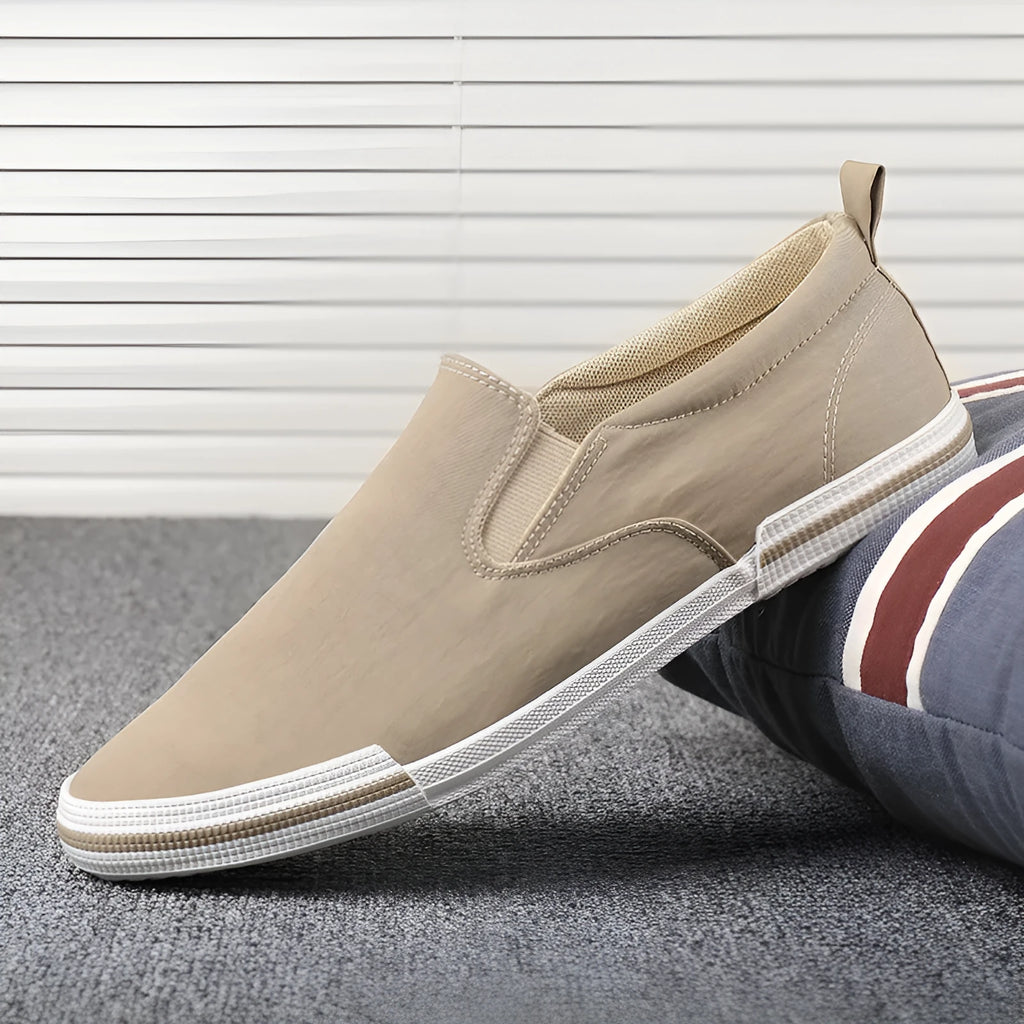 Men's low-top canvas sneakers in grey, black orange, or khaki with a vulcanised rubber sole.