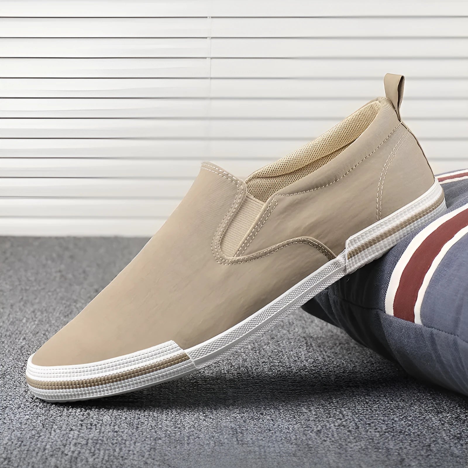 Men's low-top canvas sneakers in grey, black orange, or khaki with a vulcanised rubber sole.