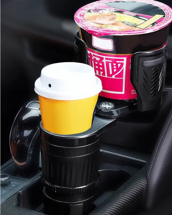 Black carbon fibre finish car cup holder with retractable adjustable base for drink bottles.