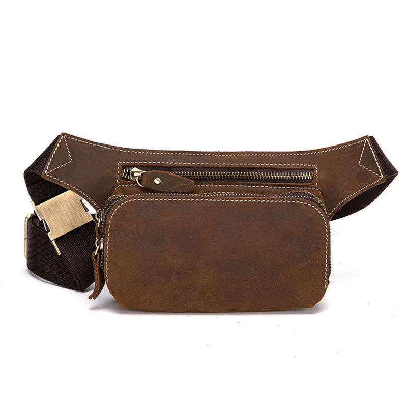 Brown top layer cowhide men's waist bag with pull-cord closure, shown open to reveal internal laptop sleeve and phone pocket.