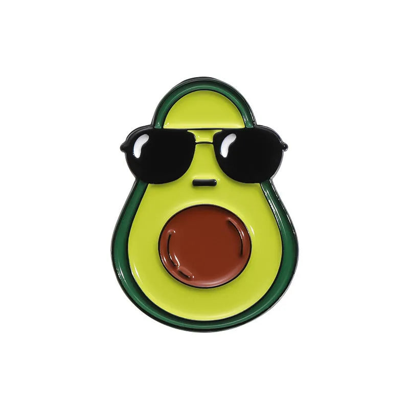 Colourful cartoon-style fruit metal brooch with pin clasp on a denim jacket lapel.
