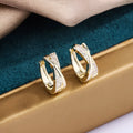 Geometric zircon earrings in 14K yellow colour crafted from copper