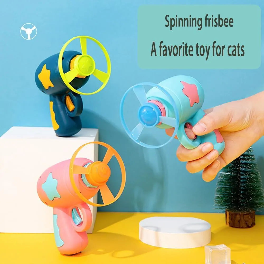 Blue interactive cat toy gun with a plastic frisbee, for indoor cat play.