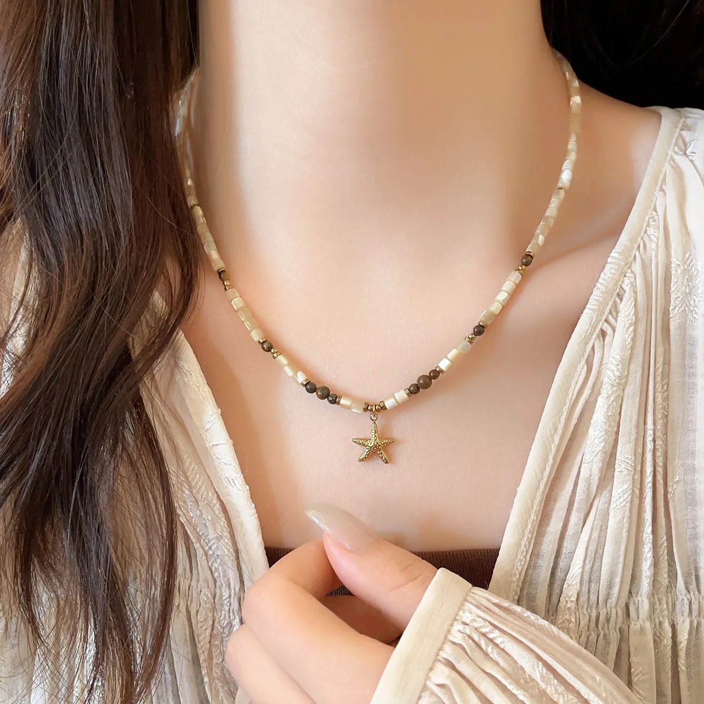 Titanium steel starfish pendant necklace with natural shell and tigereye on a beaded Maillard style chain