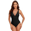 Women's solid colour cross shoulder one-piece nylon swimsuit on a model.