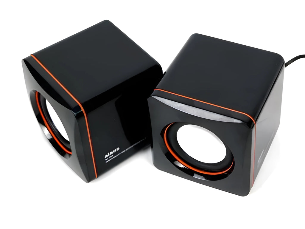 Small square black USB-powered 2.0 desktop computer speaker on a desk.