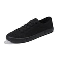 All black women's flat canvas lace-up shoes with a rubber sole