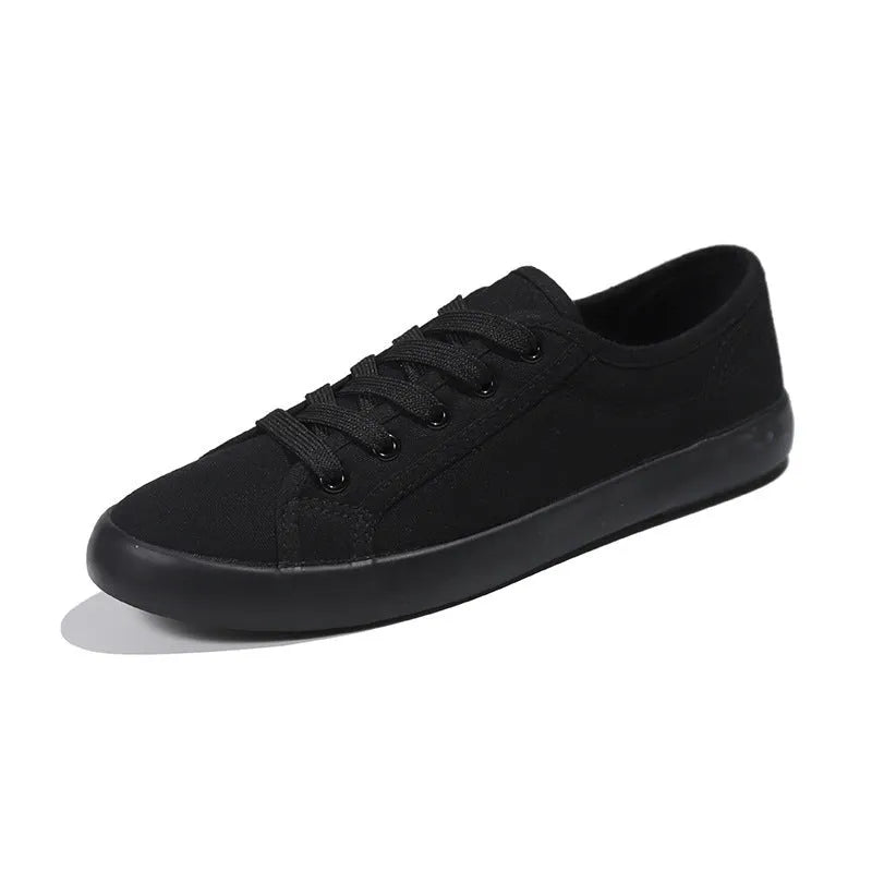 All black women's flat canvas lace-up shoes with a rubber sole