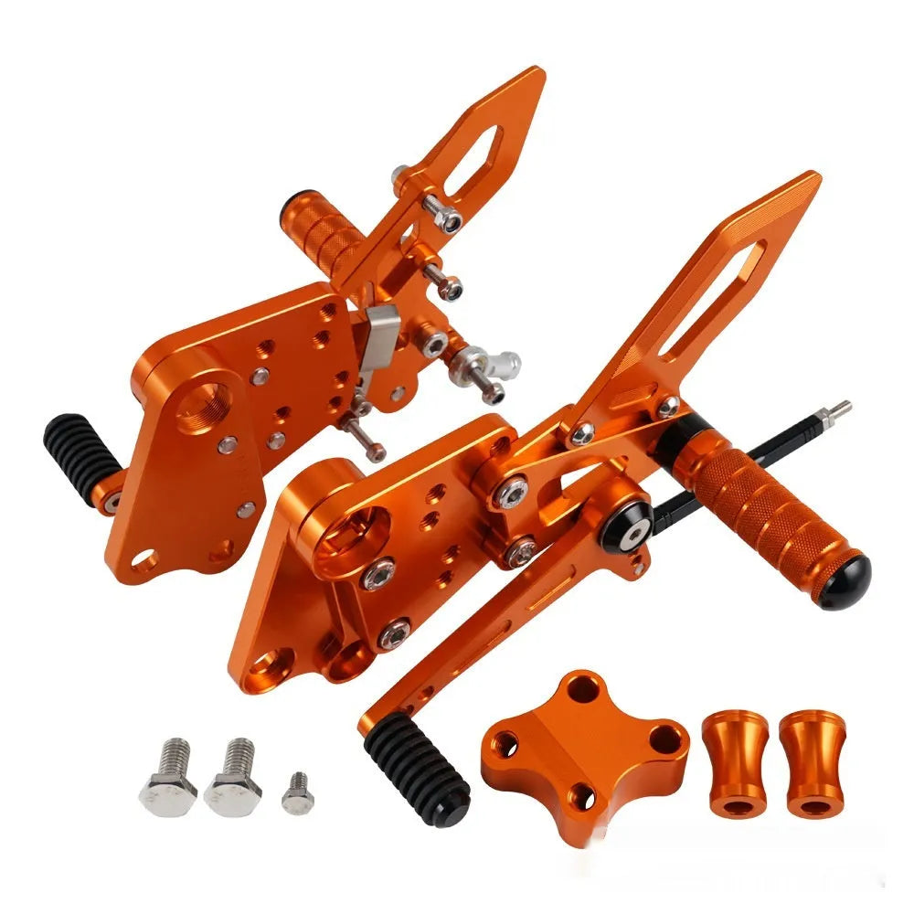 Black and orange KTM Duke motorcycle rear shift pedal support bracket assembly.