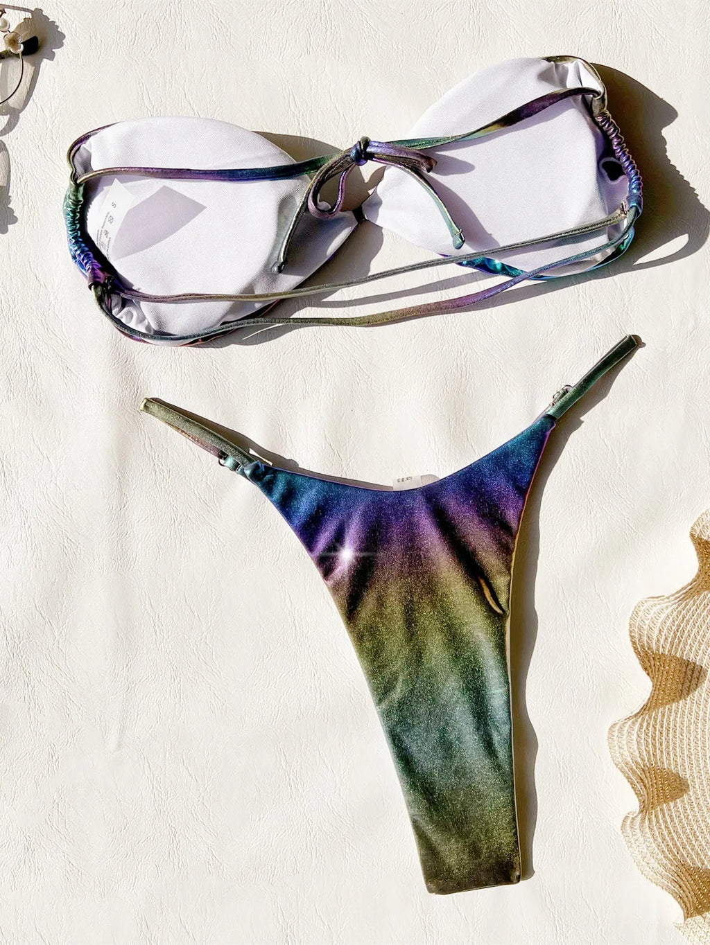 Women's gradient purple two-piece bikini swimsuit set on a mannequin.