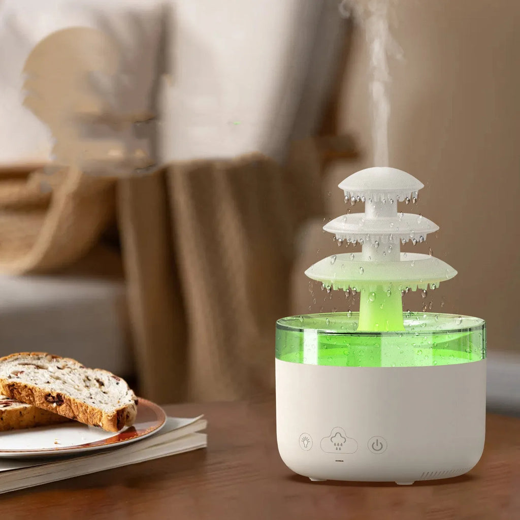 White Cloud Rain ultrasonic humidifier and essential oil diffuser with coloured LED lights on a table.
