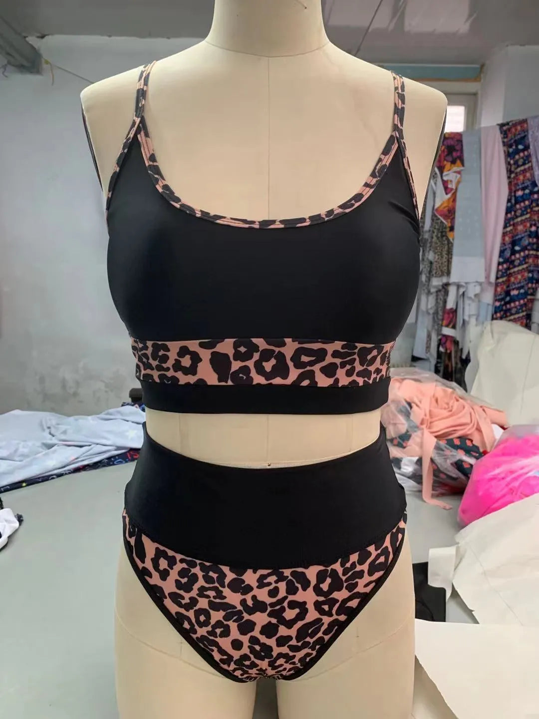 White and leopard print women's high waist bikini swimsuit with split briefs.
